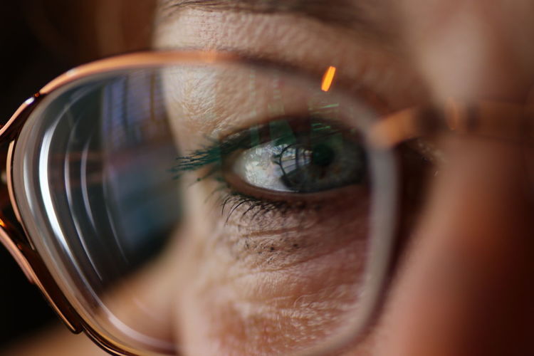Cropped portrait of woman wearing eyeglasses