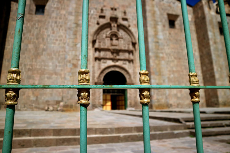 Closeup the ornate fence with blurry side door of puno cathedral, puno, peru