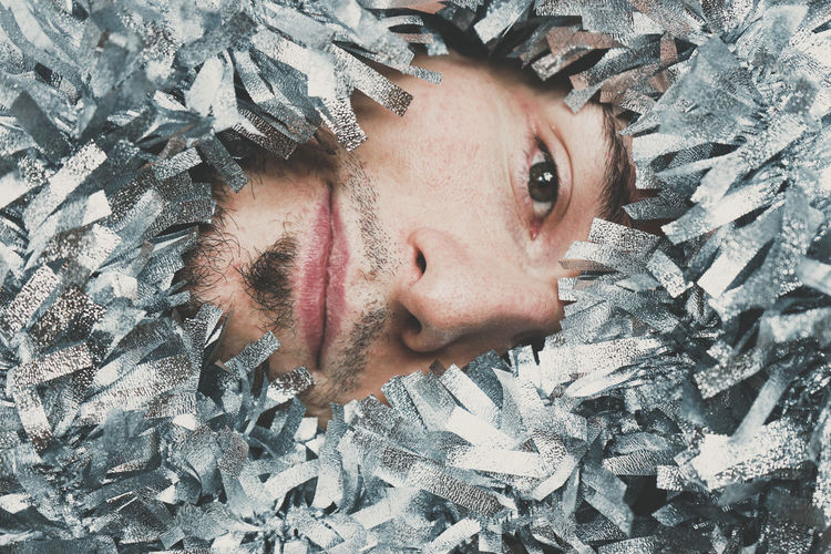 Close-up portrait of young man during winter