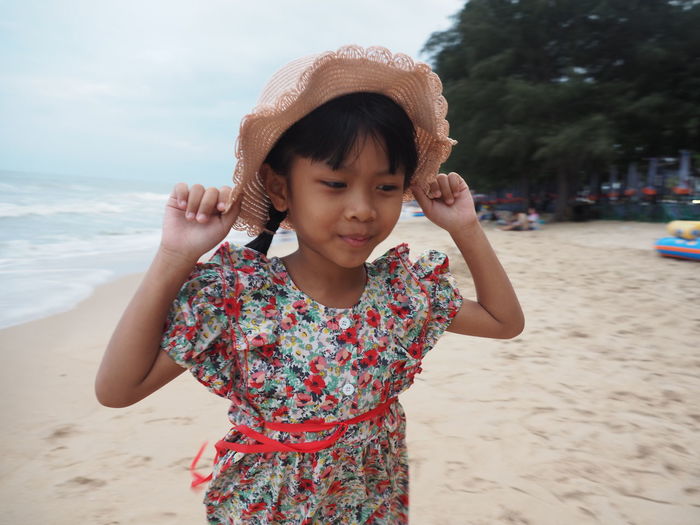 Portrait of girl standing on beach