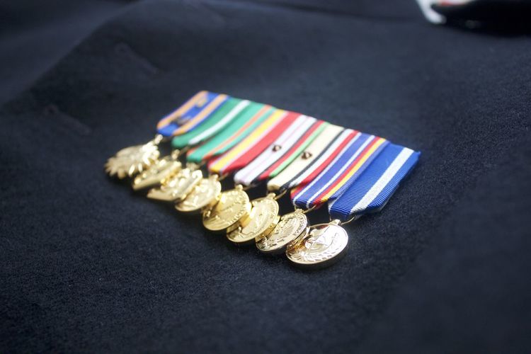 Close-up of medals on uniform