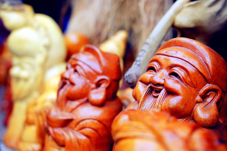 Close-up of wooden sculptures at store