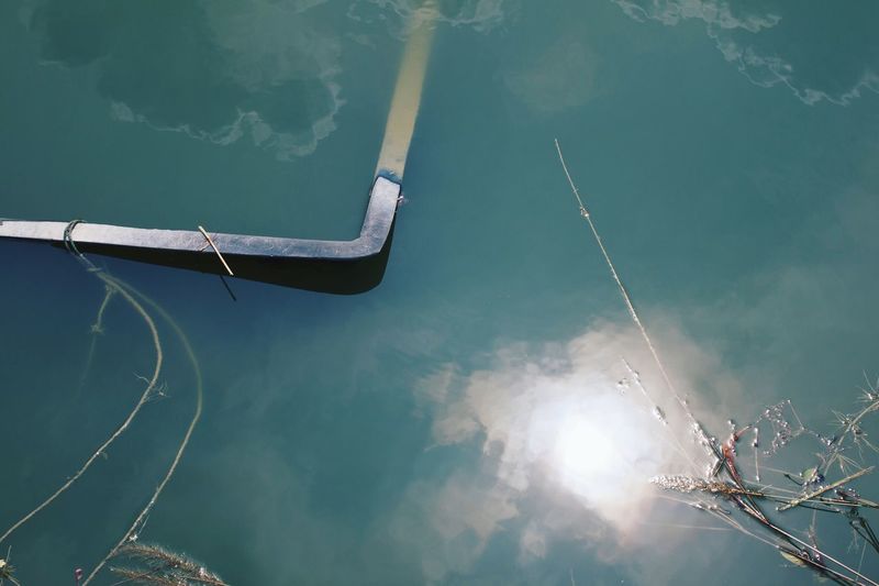High angle view of metallic structure in lake