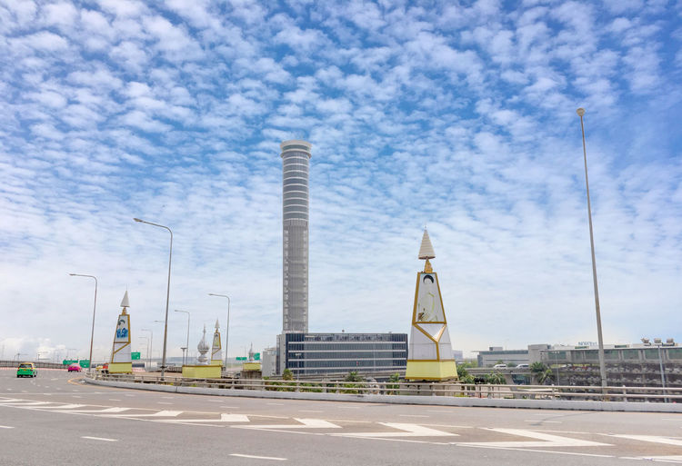 View of factory against cloudy sky