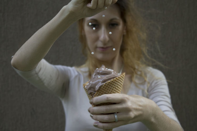 Close-up of a woman holding ice cream