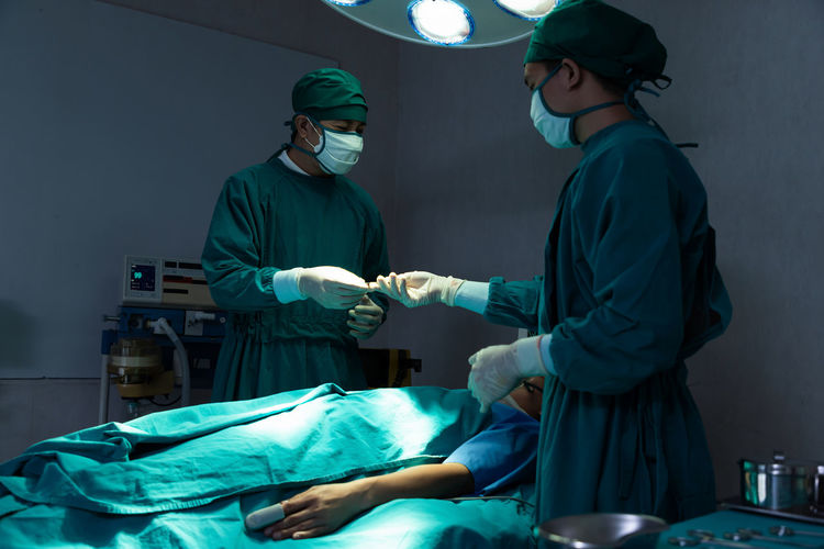 Surgeons performing surgery at operating room