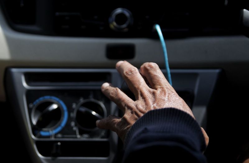 Driver hand hold a car gearshift