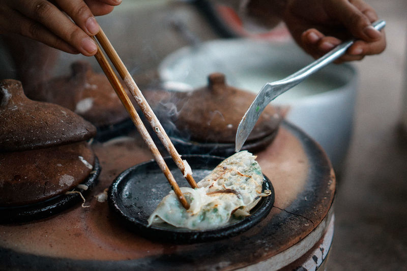 "Bánh Xèo" vietnamese cuisine Vietnamese Food Banh Xeo Close-up Eating Utensil Food And Drink Freshness Hand Hoang Ann Holding Human Body Part Human Hand Kitchen Utensil One Person Preparation Preparing Food My Best Photo