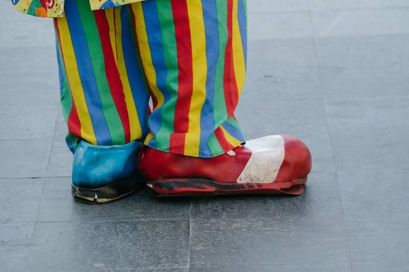 Close-up of red shoes on tiled floor
