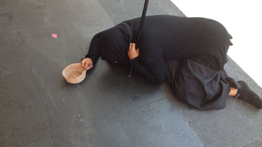 Beggar kneel down on floor