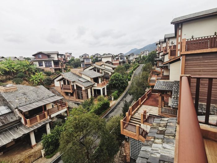 High angle view of residential buildings against sky