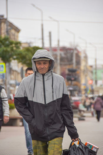 Portrait of man standing on street