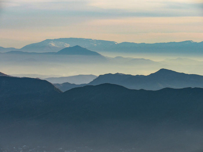 Scenic view of mountains against sky during sunset