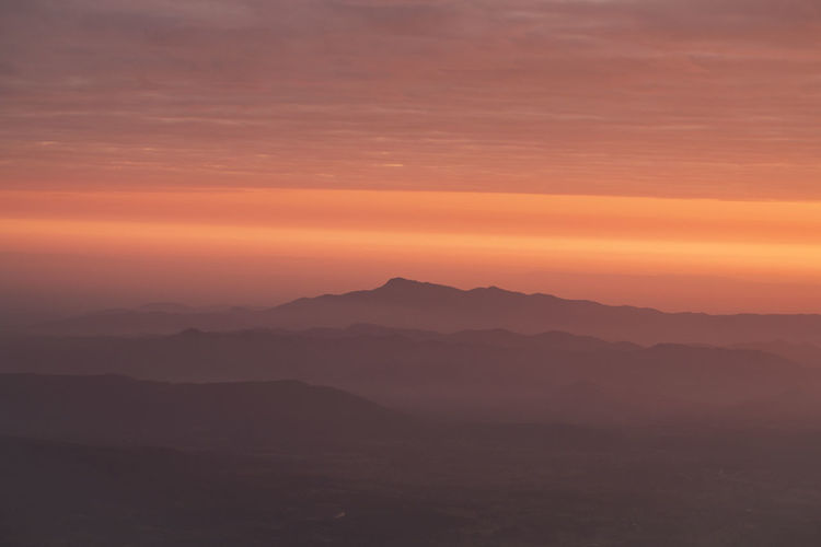 Layer of mountains with misty in morning