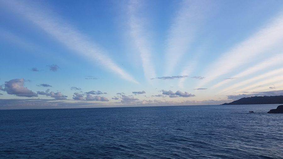 Scenic view of sea against blue sky