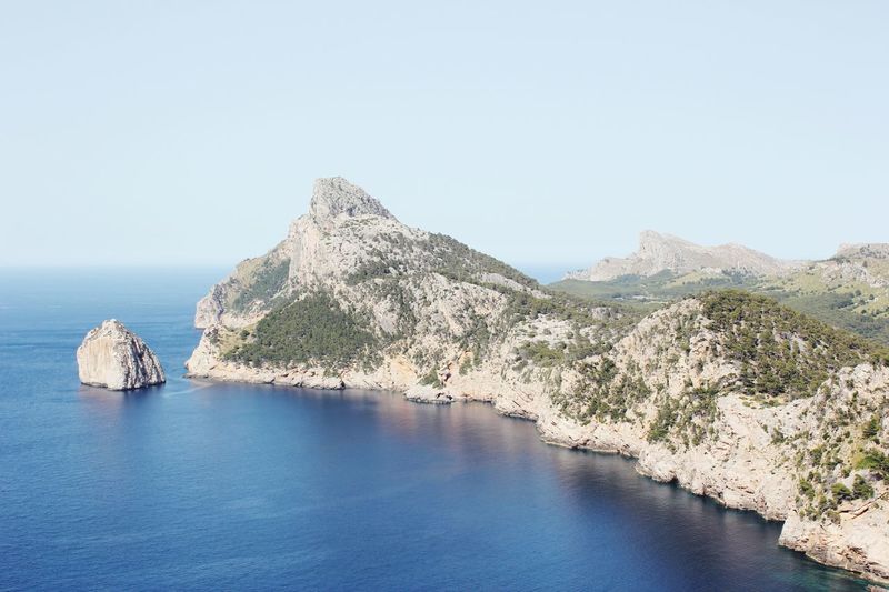 Scenic view of cabo formentor by sea against sky