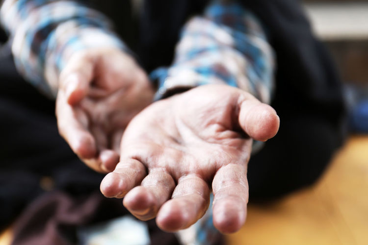 Cropped image of homeless man gesturing