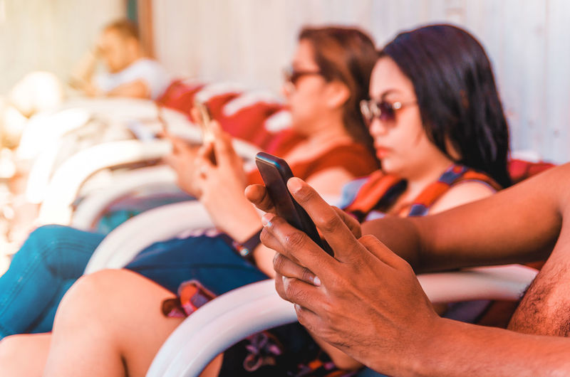 Midsection of woman using mobile phone