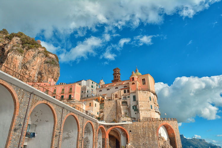 Amalfi coast at sunset, low angle view of old building against sky