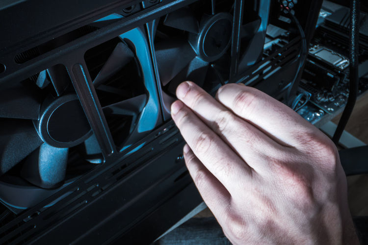 Cropped hand of man using car