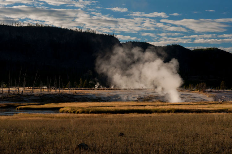 Steam rising from hot spring at yellowstone national park