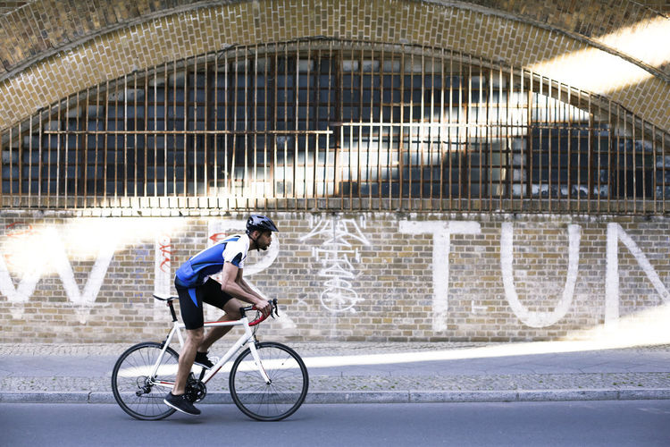 Young man riding bicycle in the city