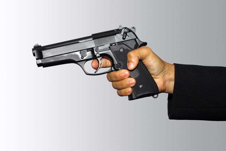 Side view of man using mobile phone against white background