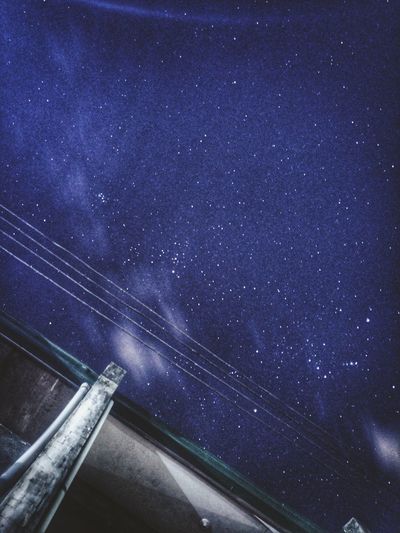 Low angle view of stars against sky at night