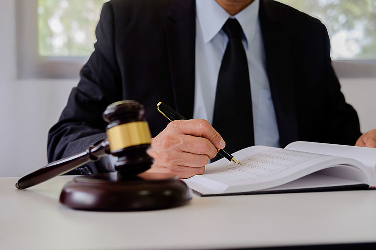 Lawyer working at desk in courtroom
