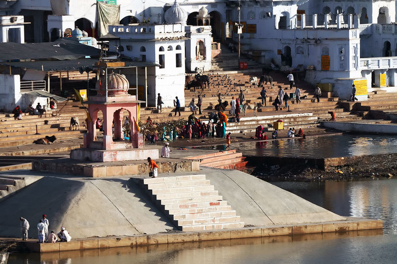 Pilgrims at pushkar lake on sunny day