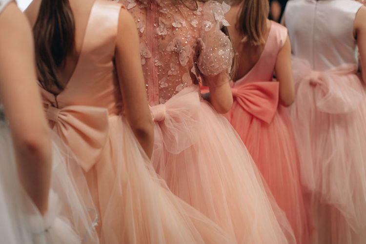 Details of a baby pink fluffy dresses with a pretty bow on the back