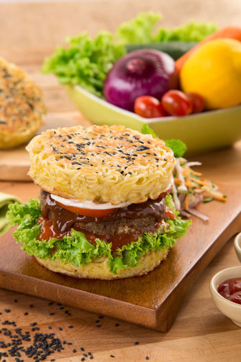 Close-up of fresh ramen burger on table
