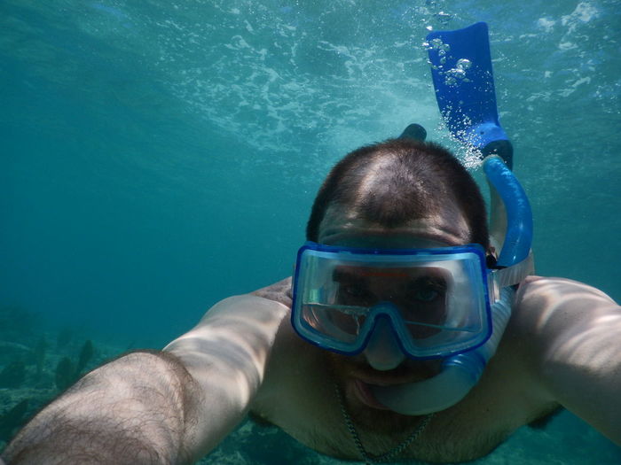 Portrait of man swimming in sea