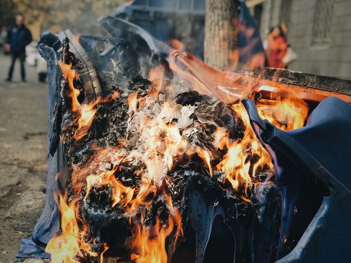 Close-up of burning vehicle on road
