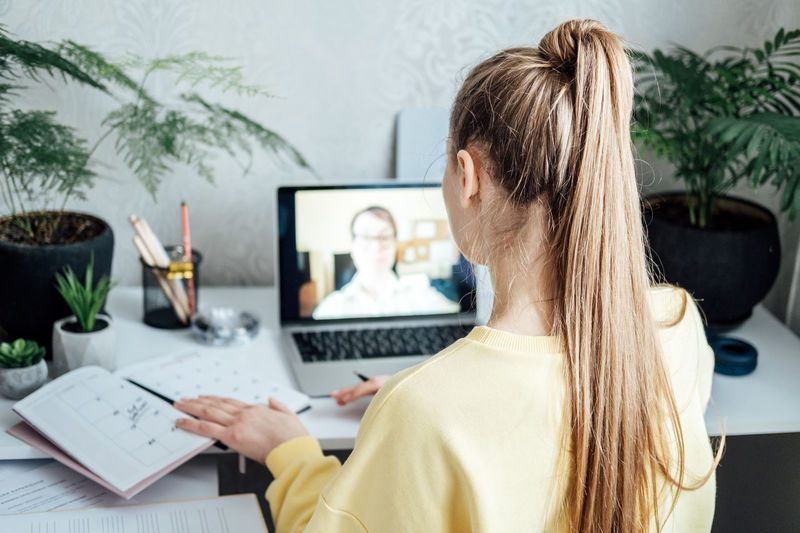 Young woman business woman student teacher tutor having online virtual video call. freelancer