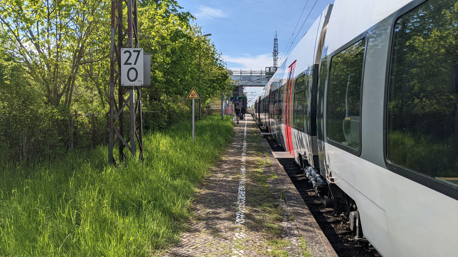 Train on railroad track against sky