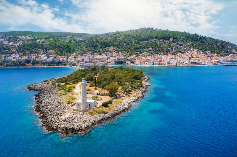 Panoramic view of sea and buildings against sky