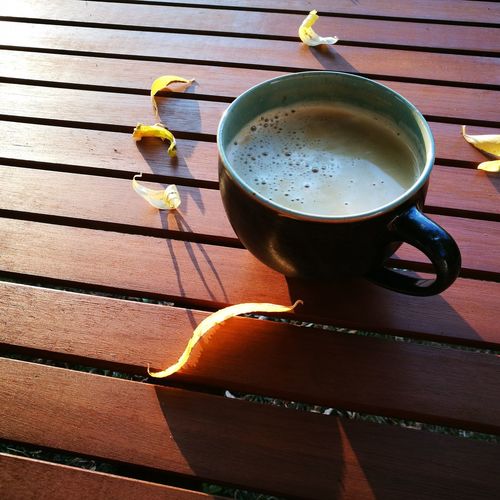 High angle view of coffee cup on table