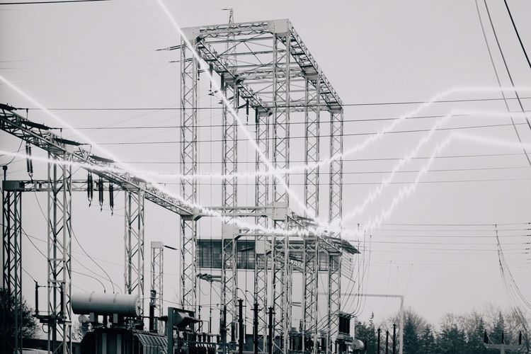 Electricity pylon against clear sky
