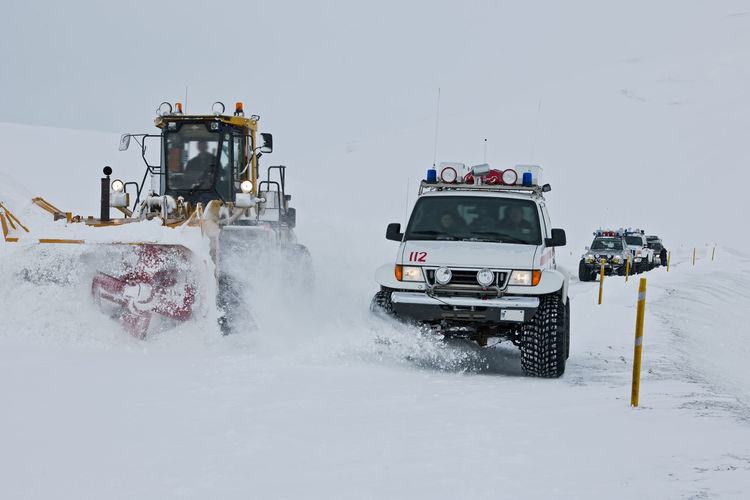 Icelandic rescue-teams overtaking a snowplough after a blizzard