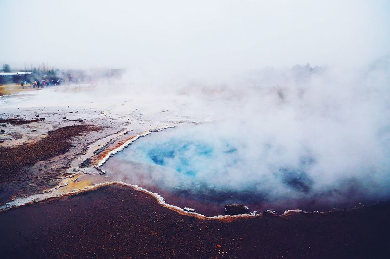 High angle view of steam over hot spring