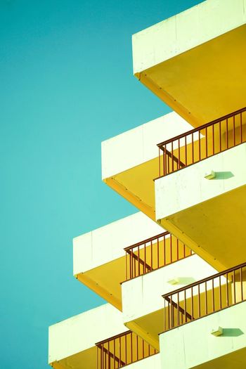 Yellow balconies and blue sky