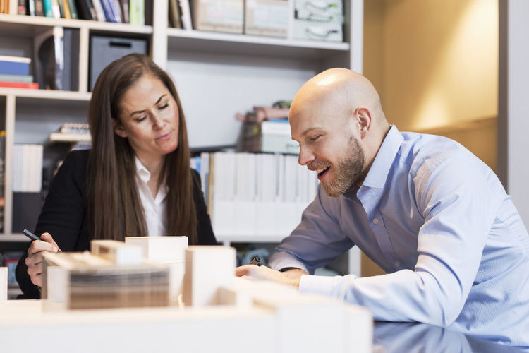 Business people discussing project at desk
