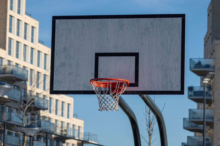 Close-up of basketball hoop against sky