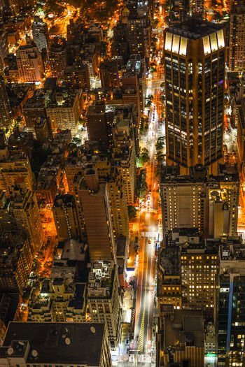 High angle view of illuminated buildings in city