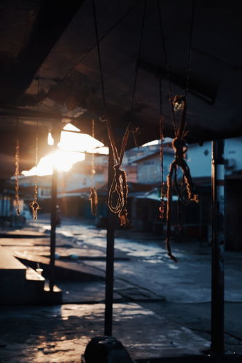 Close-up of tied ropes hanging on roof