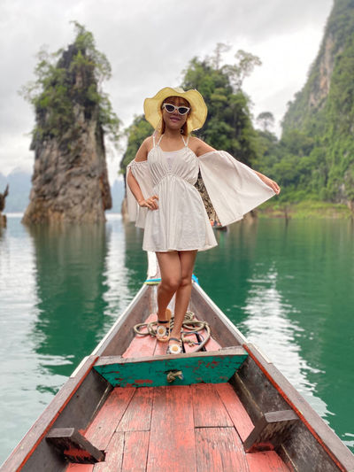Portrait of woman standing in boat
