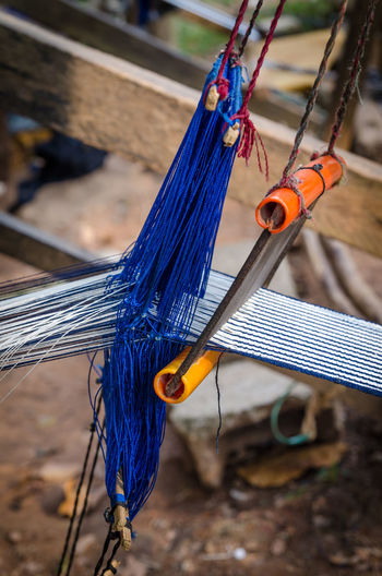Close-up of strings and woven textile outdoors, ivory coast, africa