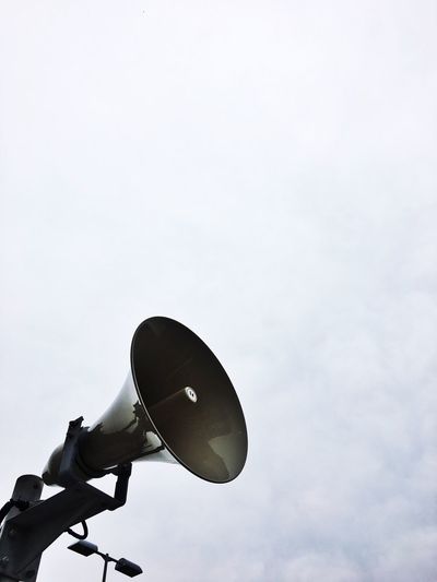 Low angle view of megaphone against sky