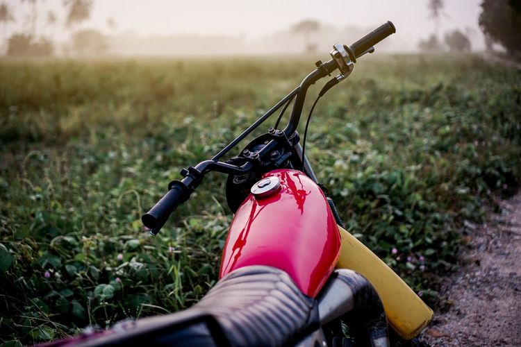 Motorcycle parked on field